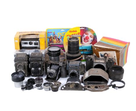 A large assortment of cameras, mostly donor cameras and spare parts. To include a Pentax 6x7, a Yashica 635, a Minolta Autoco