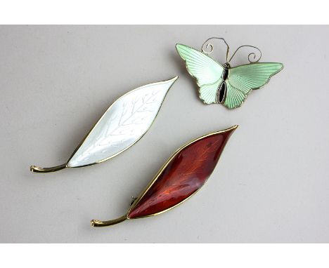 David Andersen, a silver and green enamel butterfly brooch, together with two leaf brooches in white and red enamel