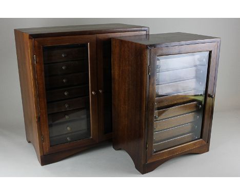 Two similar collector's tabletop cabinets of twin glazed doors enclosing two rows of nine short drawers and a single glazed d