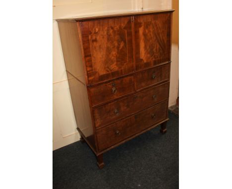 An early 20th century mahogany and walnut inlaid fall-front bureau opening onto drawers and pigeon boles, with leather inset 