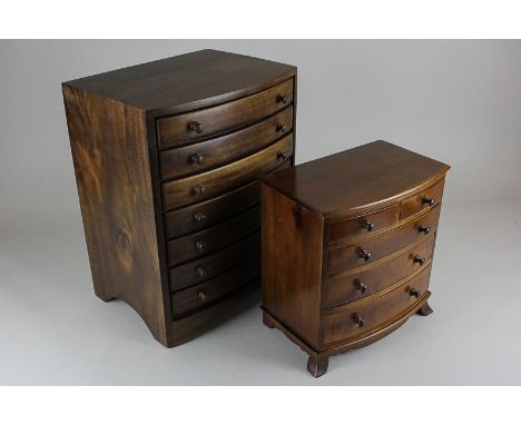 Two similar collector's tabletop cabinets of seven long drawers on bracket base and two short over three long drawers on brac