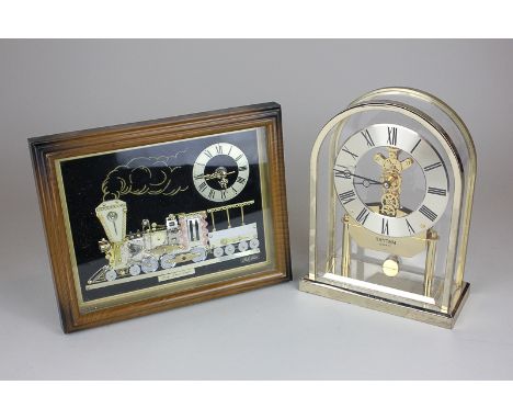A Rhythm replica steam engine clock in frame, together with a Rhythm mantel clock