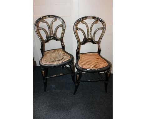 A pair of 19th century ebonised salon chairs, probably French, with C scroll pierced backs inlaid with mother of pearl, cane 