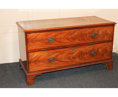 A mahogany low chest of two drawers on bracket feet, 131cm
