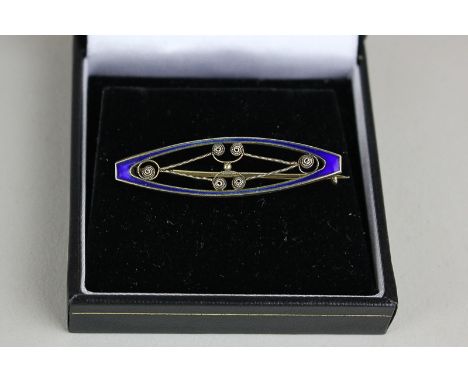 David Andersen, a silver and blue enamel bar brooch with silver wire scroll detail, circa 1920