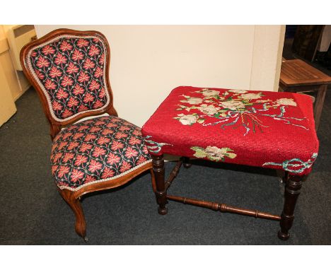 A Victorian carved walnut framed nursing chair on cabriole legs, and a tapestry seated stool with turned legs