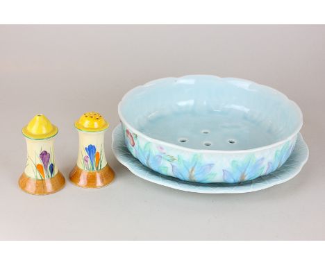 A pair of Clarice Cliff crocus pattern salt and peppers (one a/f), and a Clarice Cliff pottery cress dish with saucer
