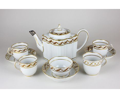 A 19th century porcelain part tea and coffee set comprising a teapot, a tea bowl with scalloped edged saucer, four coffee can