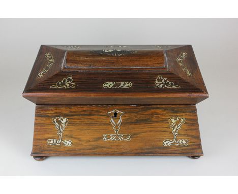 A Victorian rosewood tea caddy with bird and floral mother of pearl inlay, the sarcophagus form enclosing two monogrammed lea