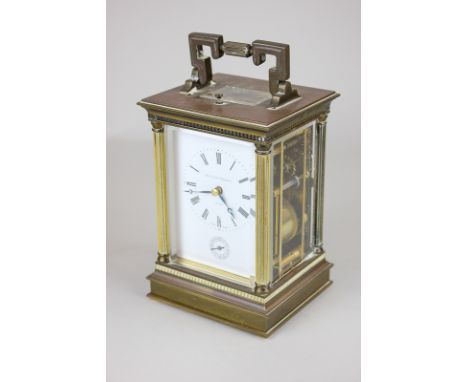 A Matthew Norman, London brass repeater carriage clock with white dial and Roman numerals, 18.5cm high