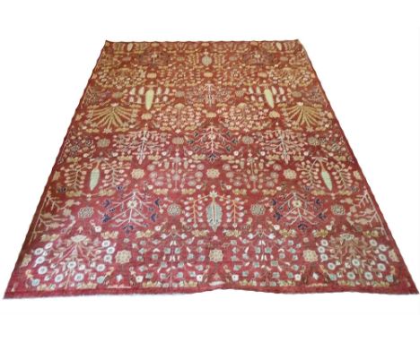 HAJI JALILI CARPET, 379cm x 271cm, all over design of flower heads, palmettes trees on ruby field.