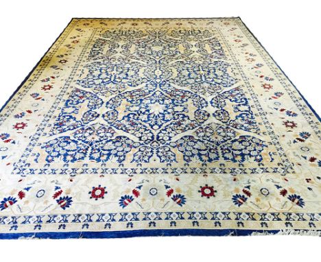 VERY FINE HAJI-JALILY DESIGN CARPET, 435cm x 308cm, stylised palmette, flowerhead and vine all over design on a sapphire blue