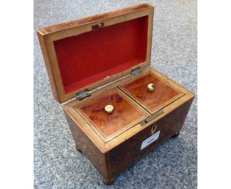 An early 19th century mahogany double tea caddy with box wood stringing