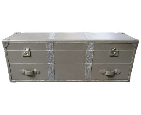 Kelly Hoppen - A rectangular trunk with hinged lid and bottom drawer, stud corners, label to the inside, 138 x 39 x 50cm