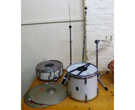 A part drum set, comprising two drums, three cymbals and stands