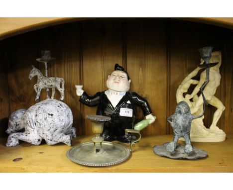 A plated chamber stick; a classical style figure; a biscuit jar in the form of a waiter etc. 