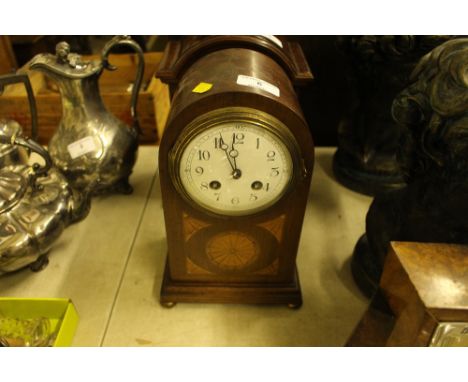 An Edwardian inlaid mahogany mantel clock with eight day movement