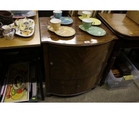 A mahogany bow fronted commode 