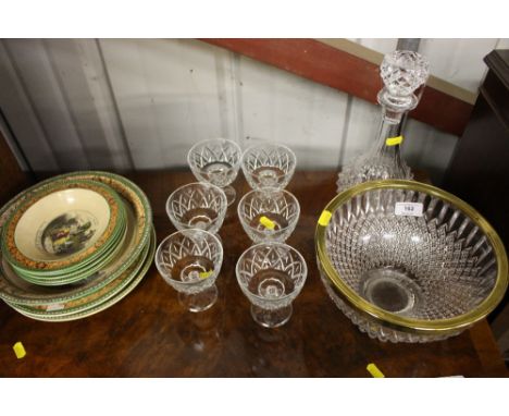 A glass decanter and stopper; a bowl with brass rim; and six sundae glasses