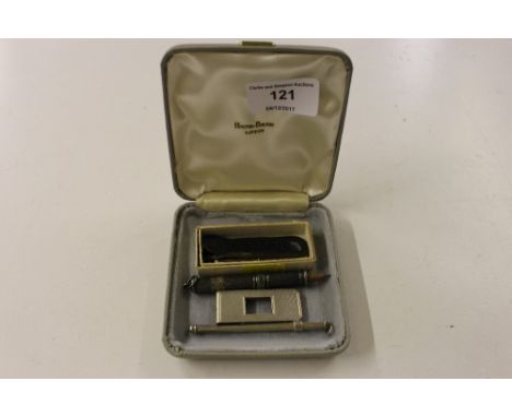 A silver money clip; a silver twizzle stick; a pencil holder etc.