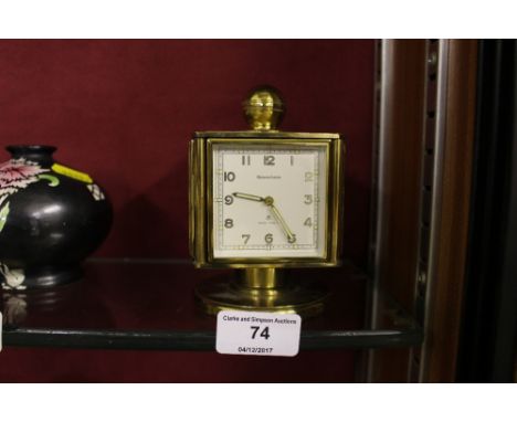 A vintage Swiss Rememberance rotating weather station / clock / hydrometer / thermometer 