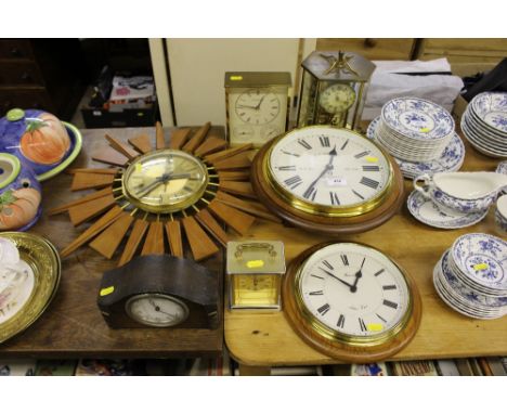 A collection of wall clocks, mantel clocks and an anniversary clock 