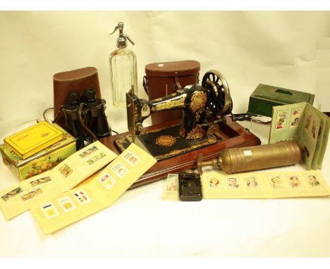 Boxes and Objects - a Jones hand cranked sewing machine; a brass Pyrene fire extinguisher; a Redgates, Nottingham soda syphon