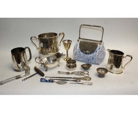 A late 19th century blue and white transfer printed biscuit barrel, with EPNS mounted swing handle; an EPNS milk jug and suga