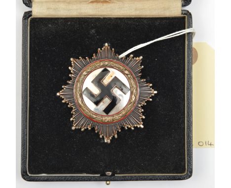 A Third Reich German Cross in gold, of heavy 10 rivet construction with maker’s mark “1” on the pin (Deschler &amp; Sohn, Mun