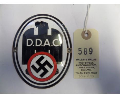A Third Reich D.D.A.C. (Die Deutsche Automobil Club) nickel plated and enamelled oval plaque,  4” x 3¼”, the eagle facing to 