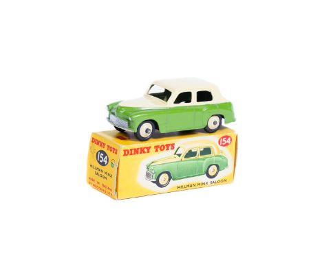 Dinky Toys Hillman Minx Saloon (154). An example in two-tone cream and light green with cream ridged wheels. Boxed, very mino