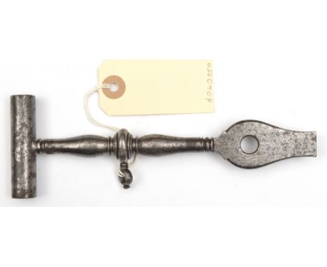 A 17th century wheellock spanner/screwdriver, with double ended tubular spanner, baluster handle and swollen screwdriver and 