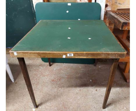 A vintage stained wood card table with baise top, set on folding legs - sold with a modern American folding leg table