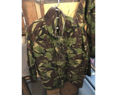 Two old Army issue camouflage field jackets