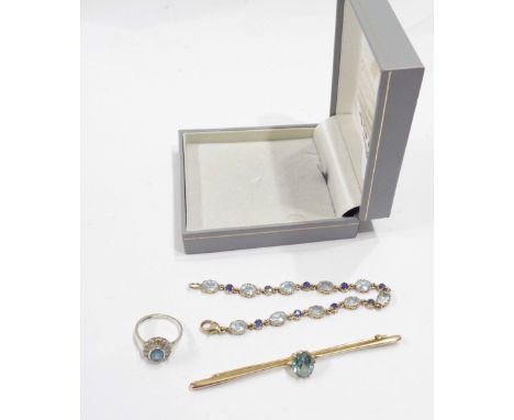 A part harlequin suite of aquamarine set jewellery comprising a yellow metal bar brooch, marked 375 bracelet and 375 white go