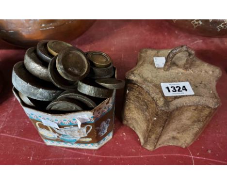 An old tin containing a large quantity of Georgian and Victorian brass and cast iron scale weights - sold with a large cast i