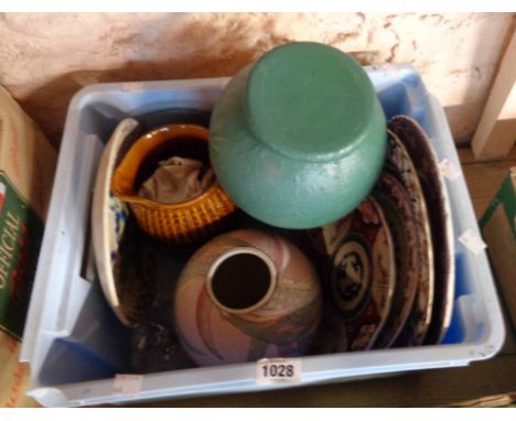 A crate containing a quantity of assorted ceramics and other items including plates, vases, etc.