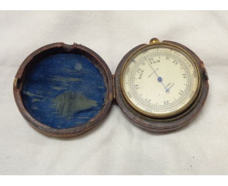 A 19th Century pocket barometer, the dial marked Tozer, Torquay in original kid leather covered pouch