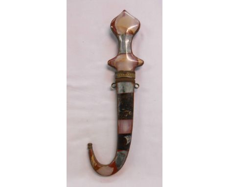 A vintage Eastern dagger with inset polished hardstone hilt and scabbard