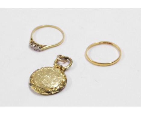 A small circular antique gilt metal mourning locket with initials to front - sold with a worn 22ct. wedding band and an illus
