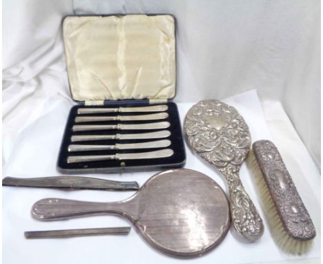 Two damaged silver mounted hand mirrors, a comb back and brush with personalised inscriptions - sold with a cased set of six 