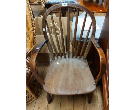 An antique oak Devon Windsor hoop stick back elbow chair with moulded solid elm seat, set on simple turned supports - old bra