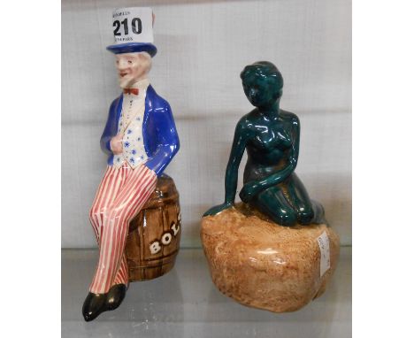 A vintage Burleigh pottery Carlsberg Danish Lager advertising figurine depicting The Little Mermaid statue - sold with a nove