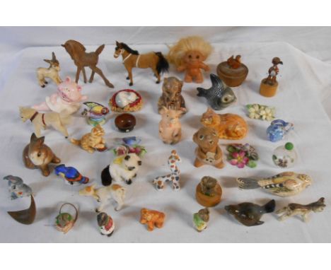 A box containing a quantity of ceramic and other animal figurines including Wade Thumper, Goebel pig, etc.