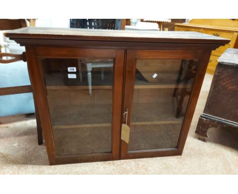 A 1.01m Edwardian walnut bookcase top with moulded cornice and shelves enclosed by a pair of glazed panel doors