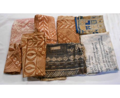 A box containing a quantity of old textiles including embroidered runner, printed commemorative items including Joe Bawker of