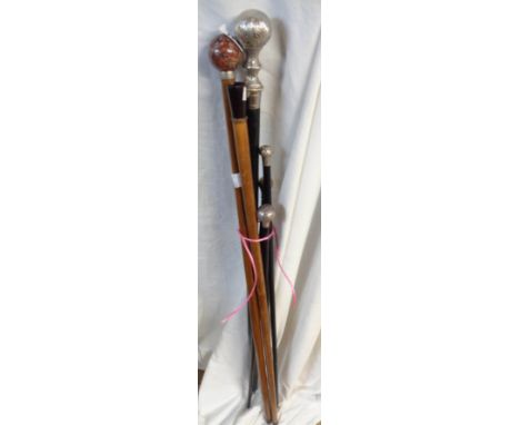 Six assorted walking sticks and canes including silver topped swagger stick for the Federation of Malaya Police, silver toppe