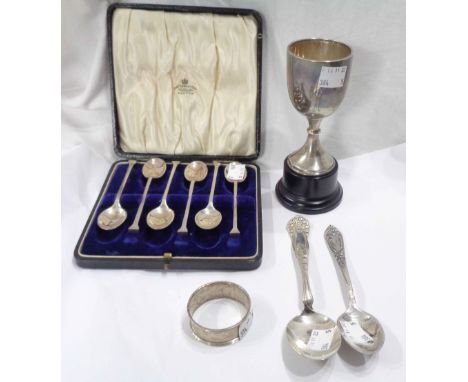 A small silver trophy cup and napkin ring - sold with a cased set of silver plated seal topped teaspoons and two other spoons