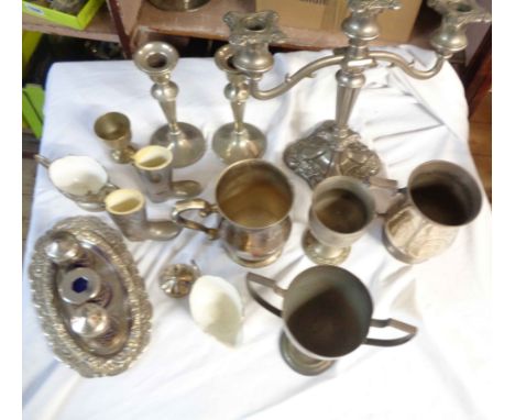 A box containing a quantity of silver plated items including twin branch three light candelabrum, tankards, etc.