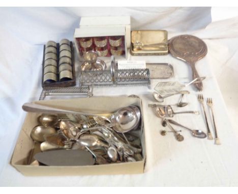 A box containing silver plated items including twelve matching napkin rings (initialled), ladle, cutlery, also a silver mount